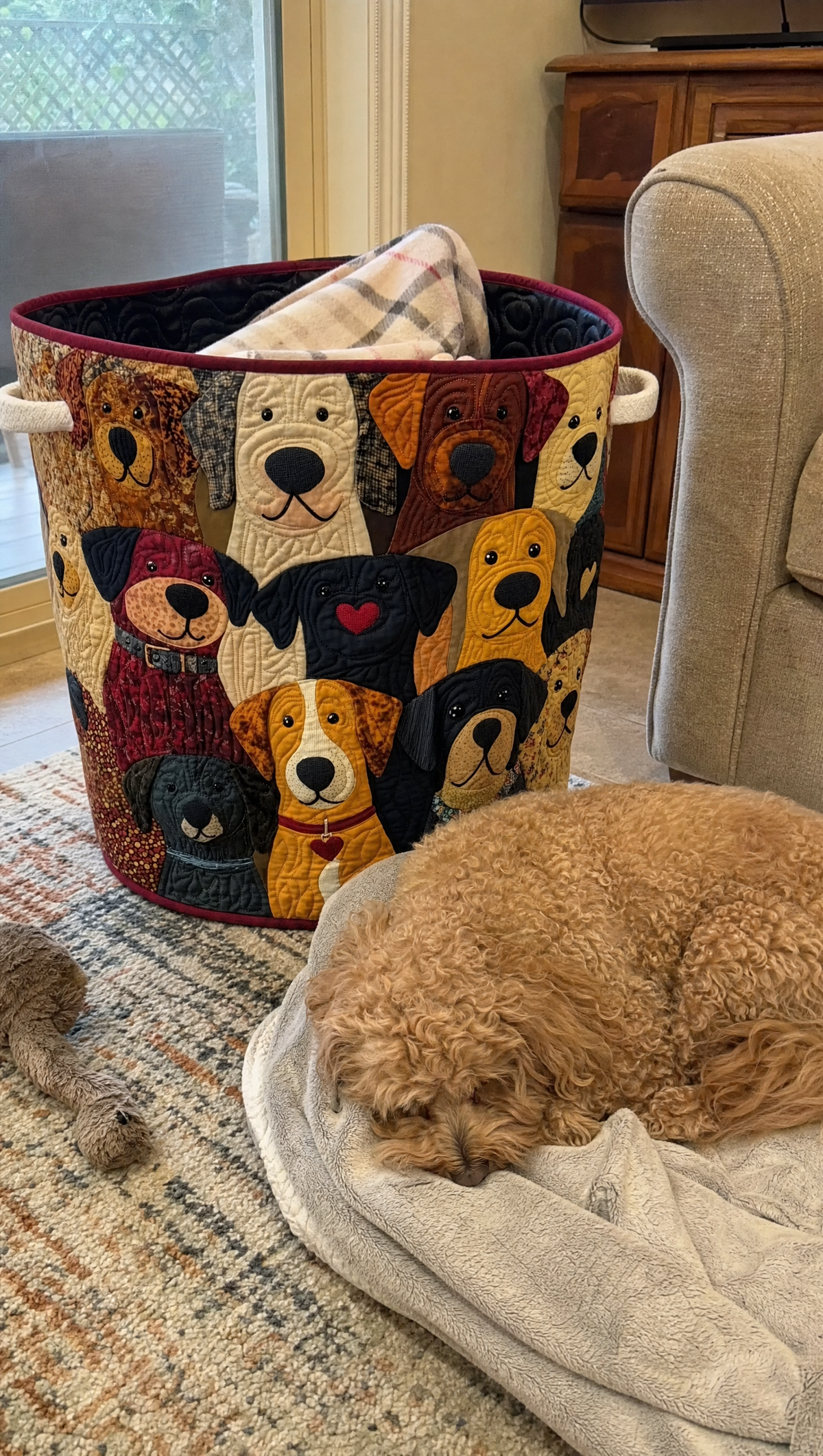 A dog asleep beside a quilted basket
