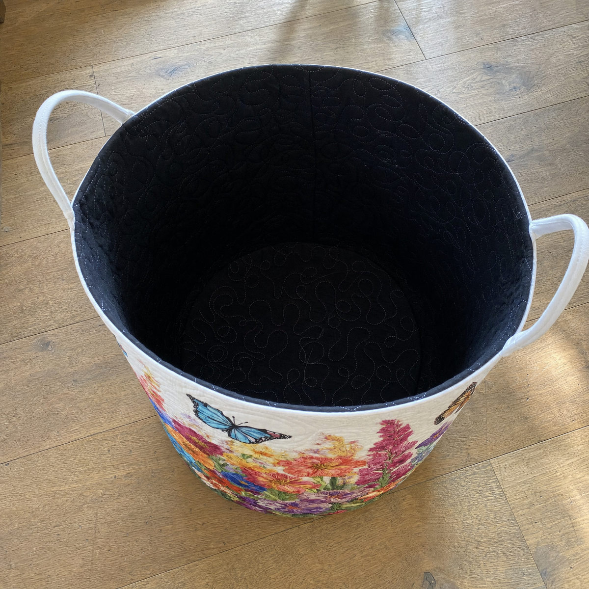 The quilted lining inside the basket