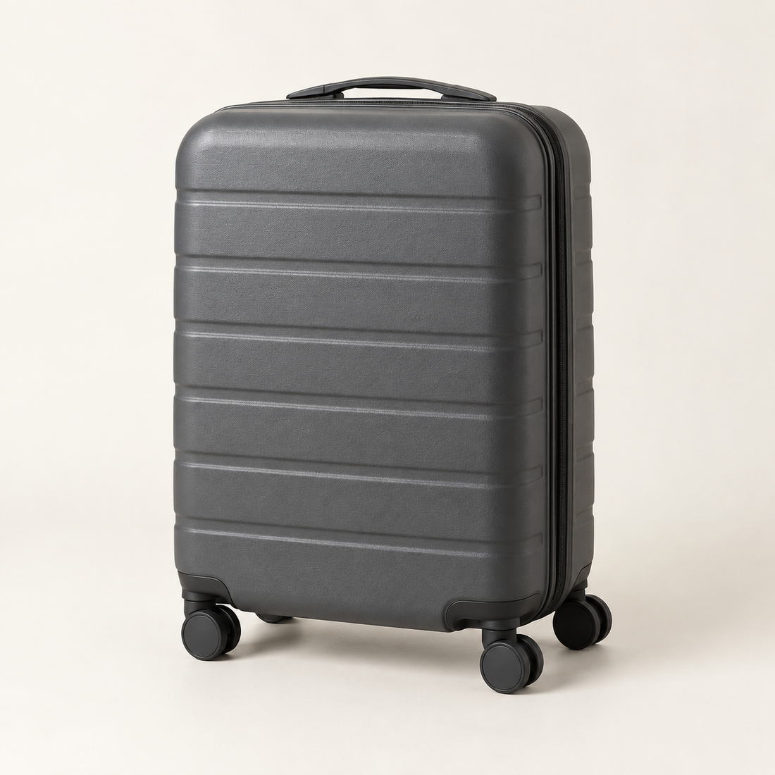 Illustrative unbranded grey hard-shell suitcase with a clamshell opening