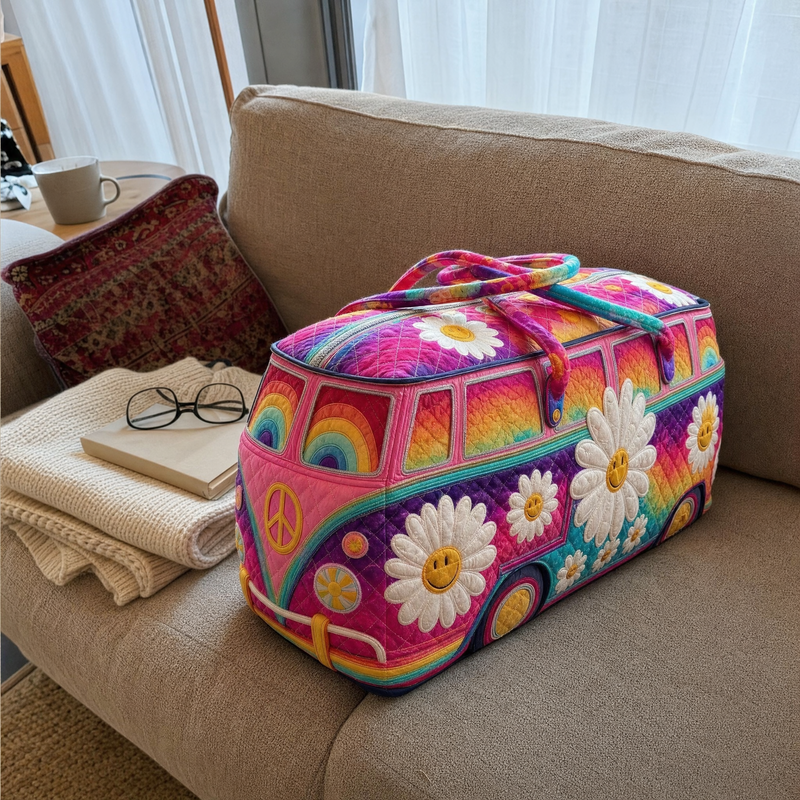 Pink rainbow and daisy quilted duffle on a sofa